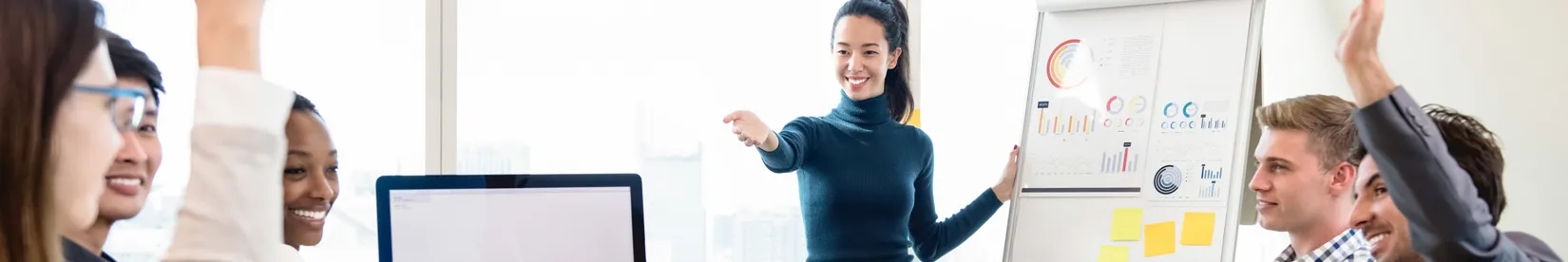 Woman teaching an in-person training class. 