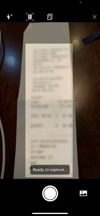 Frame your receipt on the screen and tap the Capture button. Concur scans the receipt and amount.